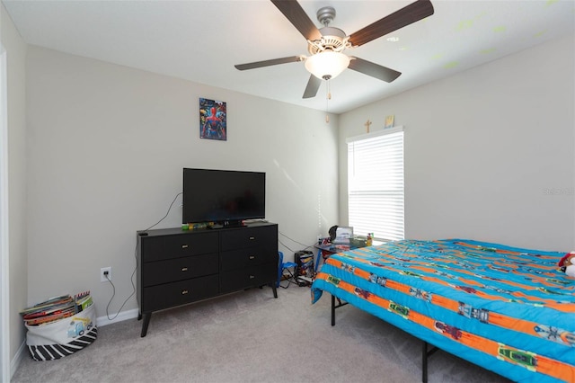 bedroom featuring ceiling fan, baseboards, and light colored carpet