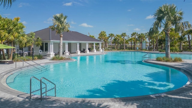 pool featuring a patio and fence