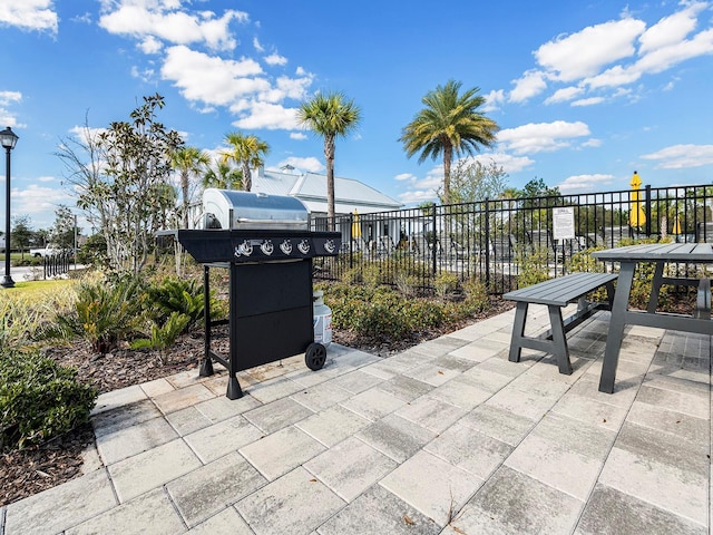 view of patio / terrace featuring grilling area and fence