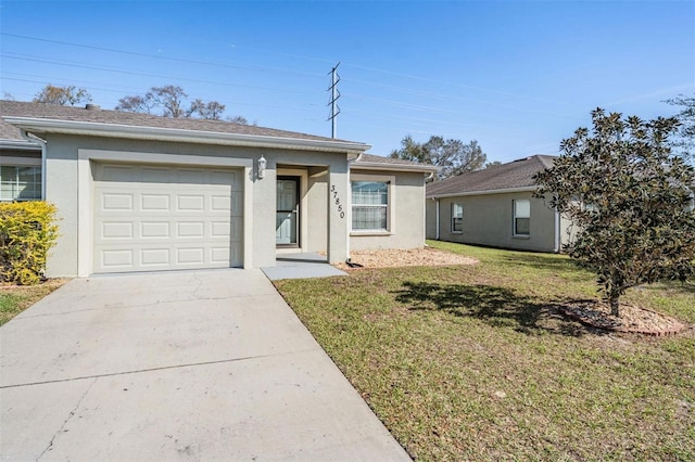 ranch-style house featuring a garage, a front lawn, concrete driveway, and stucco siding