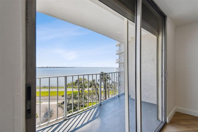 balcony featuring a water view