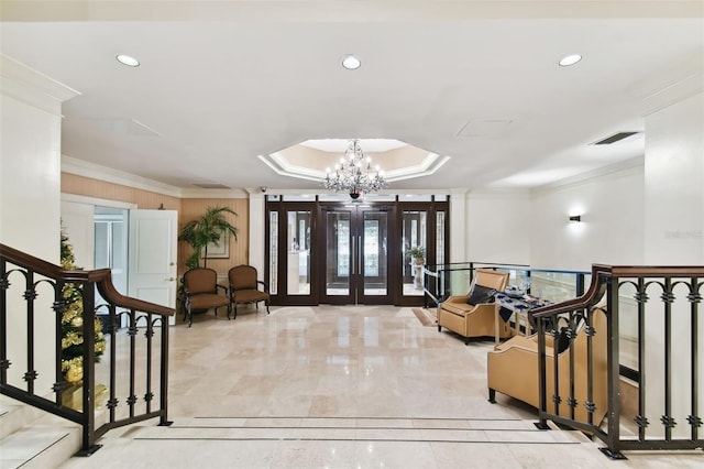 entrance foyer with a tray ceiling, visible vents, recessed lighting, and crown molding