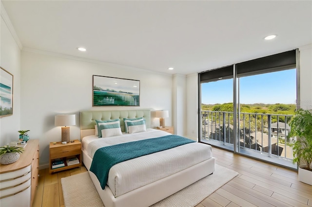 bedroom with crown molding, floor to ceiling windows, recessed lighting, light wood-style flooring, and access to outside