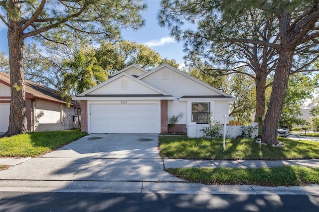 ranch-style house featuring a garage, driveway, a front yard, and brick siding