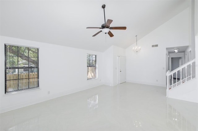 unfurnished room featuring ceiling fan with notable chandelier, visible vents, high vaulted ceiling, baseboards, and stairs