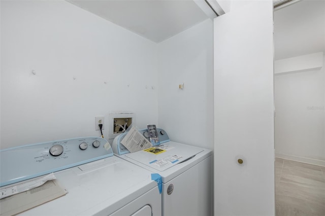 laundry room featuring laundry area and separate washer and dryer