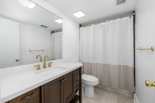 bathroom featuring toilet, vanity, visible vents, and a shower with curtain