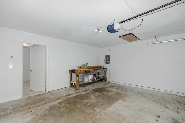 garage featuring electric panel and a garage door opener