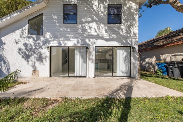 back of property with a patio area