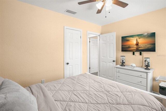 bedroom featuring visible vents and ceiling fan