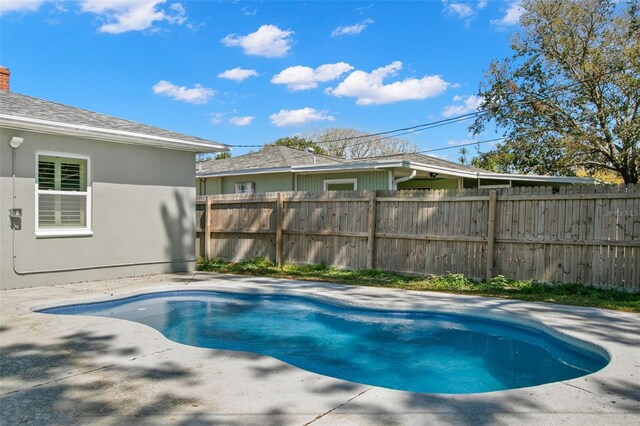 view of pool with a patio, fence, and a fenced in pool