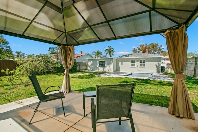 view of patio with a gazebo and a fenced backyard