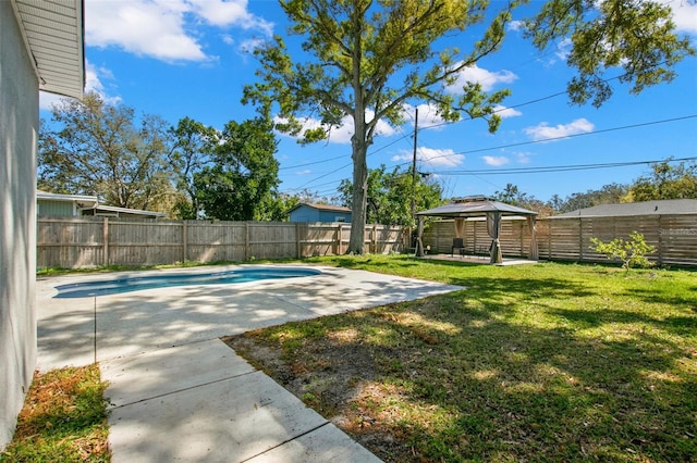 view of yard with a gazebo, a patio area, a fenced in pool, and a fenced backyard