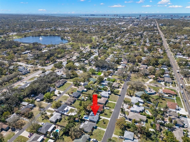 bird's eye view with a residential view and a water view