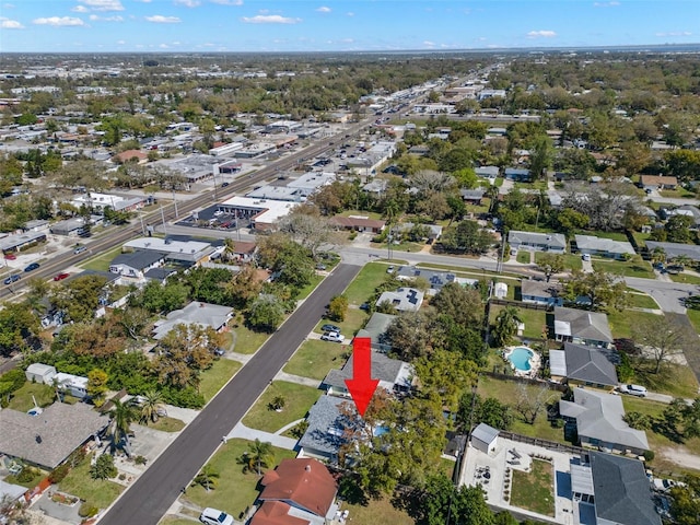 birds eye view of property with a residential view