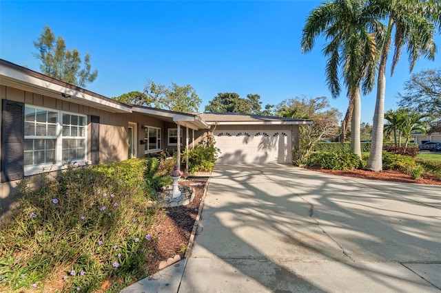 single story home with an attached garage and driveway