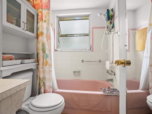 bathroom with toilet and shower / tub combo