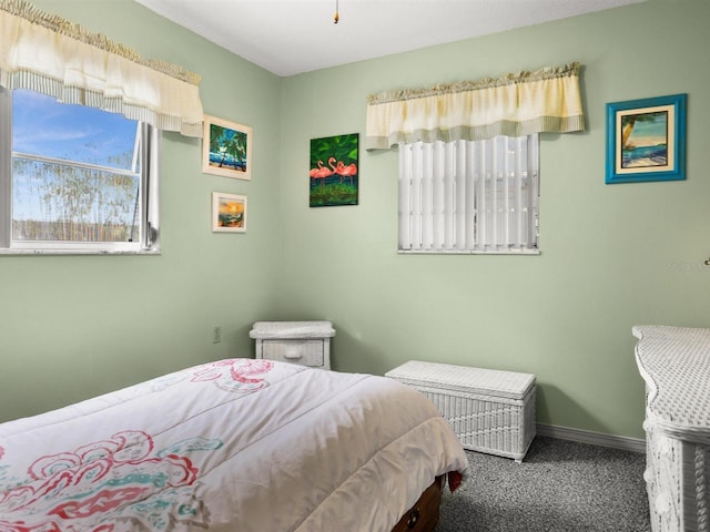 carpeted bedroom with baseboards