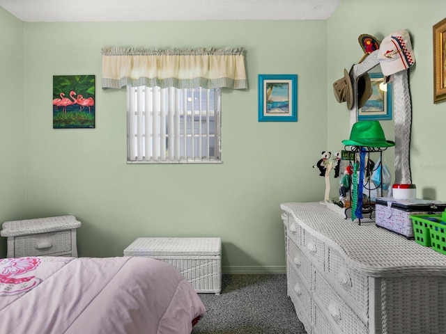 carpeted bedroom featuring baseboards