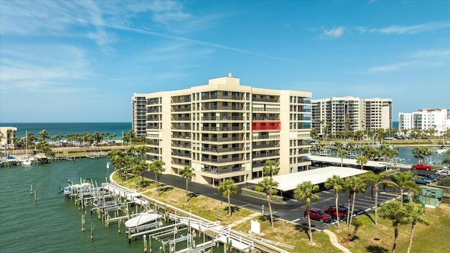 exterior space featuring a view of city, boat lift, and a boat dock