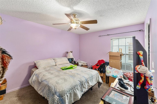 bedroom featuring ceiling fan, a textured ceiling, carpet flooring, and baseboards