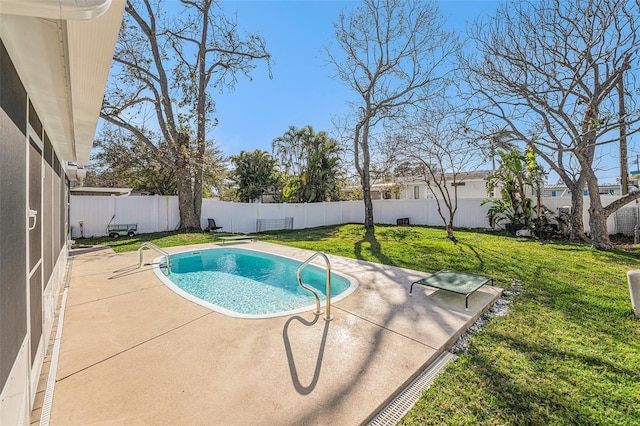 view of pool with a patio, a lawn, a fenced backyard, and a fenced in pool