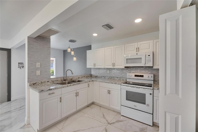 kitchen featuring white appliances, a sink, visible vents, marble finish floor, and backsplash