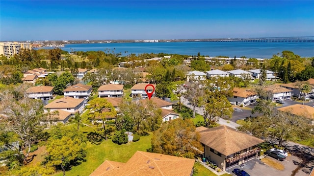 bird's eye view featuring a residential view and a water view