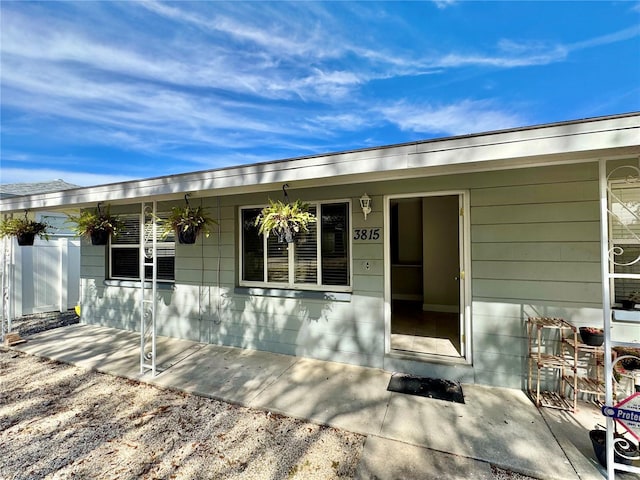 property entrance with covered porch