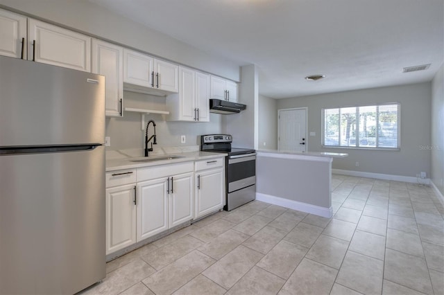 kitchen with visible vents, under cabinet range hood, light countertops, a sink, and stainless steel appliances