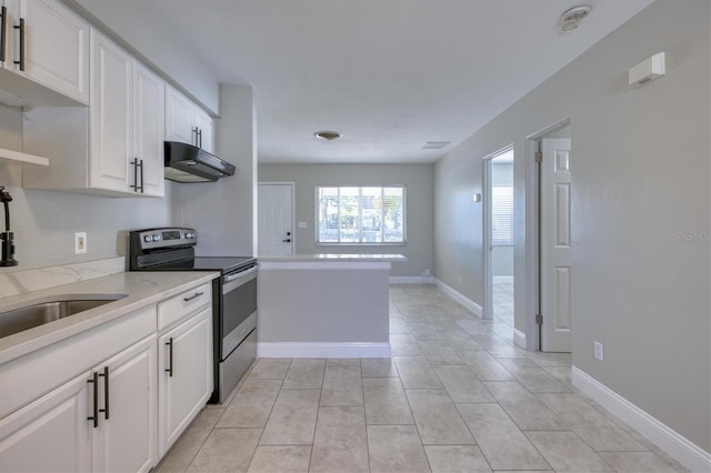 kitchen with light tile patterned floors, white cabinets, ventilation hood, electric range, and light stone counters