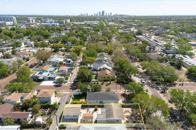 birds eye view of property featuring a city view and a residential view