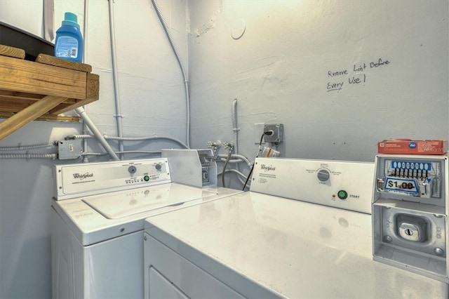 clothes washing area featuring washer and dryer