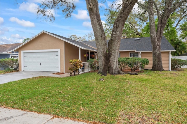 ranch-style home with a garage, concrete driveway, a front lawn, and stucco siding