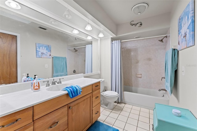 full bathroom with tile patterned flooring, toilet, visible vents, vanity, and shower / bath combo with shower curtain