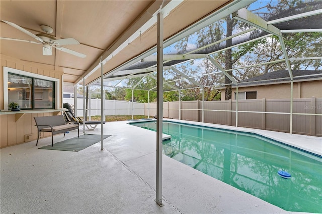 view of swimming pool with a fenced in pool, a patio, a ceiling fan, a lanai, and a fenced backyard