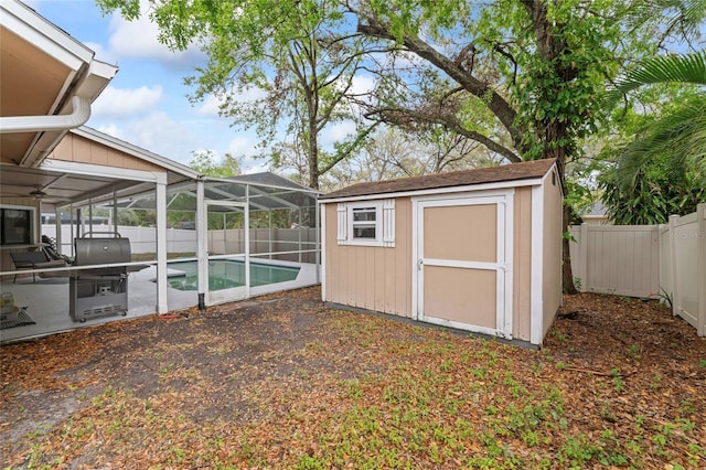 view of shed featuring a fenced backyard and a fenced in pool