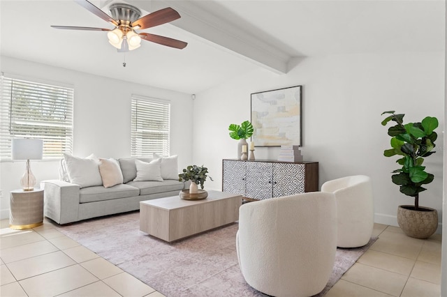 living room featuring a ceiling fan, lofted ceiling with beams, and light tile patterned floors