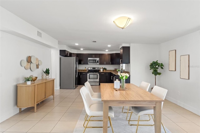 dining room featuring recessed lighting, visible vents, baseboards, and light tile patterned floors