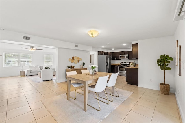 dining area with light tile patterned floors, visible vents, and recessed lighting