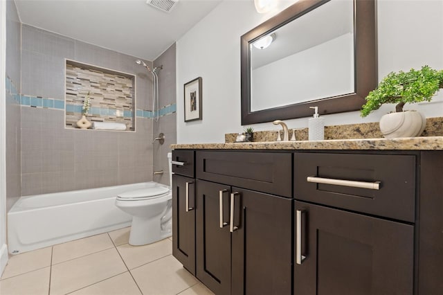 bathroom with tile patterned flooring, toilet, visible vents, vanity, and shower / bathing tub combination