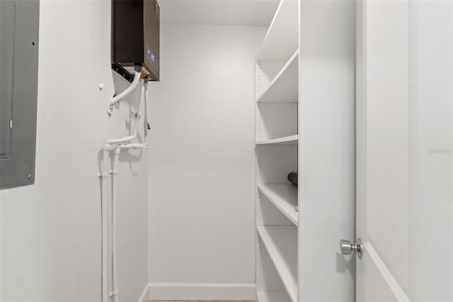 spacious closet featuring electric panel