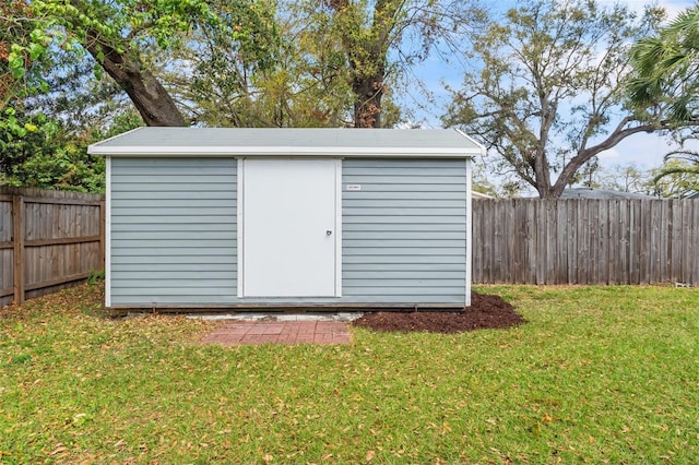 view of shed featuring a fenced backyard