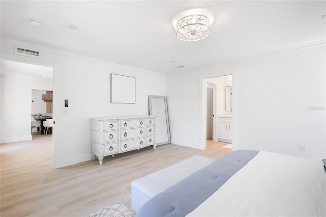 27150 Del Ln, Bonita Springs, FL 34135 - bedroom with light wood-style flooring, visible vents, baseboards, and ensuite bathroom