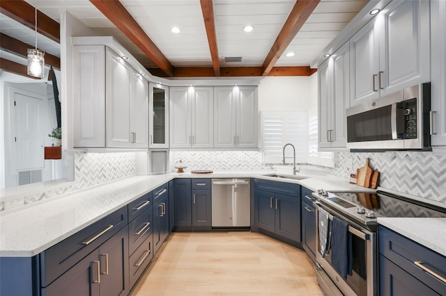 27150 Del Ln, Bonita Springs, FL 34135 - kitchen featuring blue cabinets, stainless steel appliances, and a sink