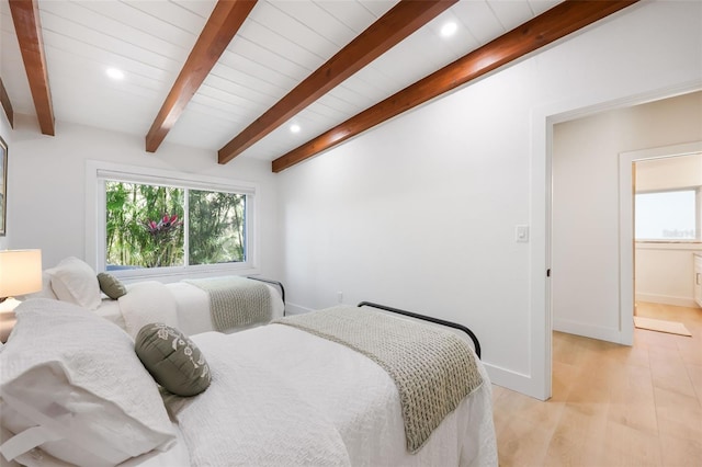 27150 Del Ln, Bonita Springs, FL 34135 - bedroom with beam ceiling, multiple windows, light wood-style flooring, and baseboards