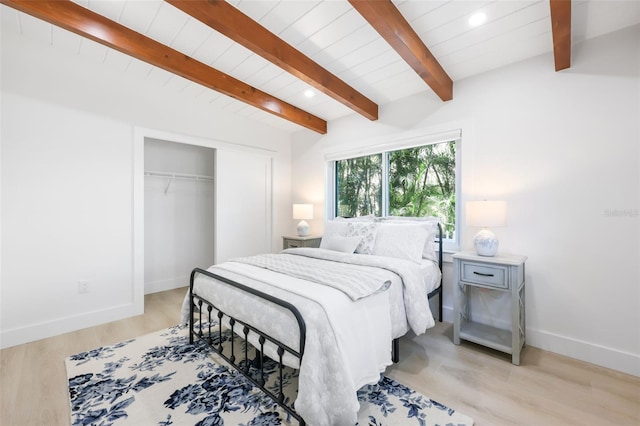 27150 Del Ln, Bonita Springs, FL 34135 - bedroom featuring light wood finished floors, baseboards, wooden ceiling, beam ceiling, and a closet