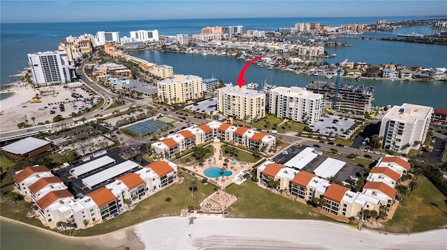 drone / aerial view featuring a view of city and a water view