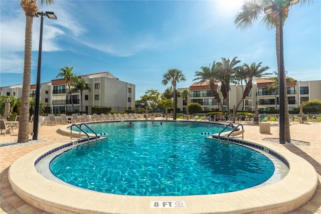 pool with a patio area