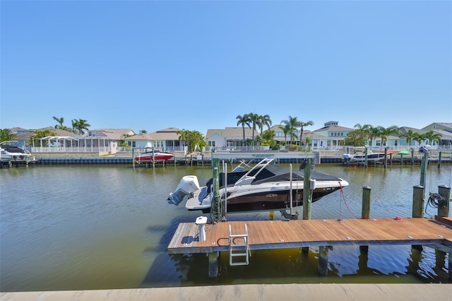 dock area with a water view and a residential view